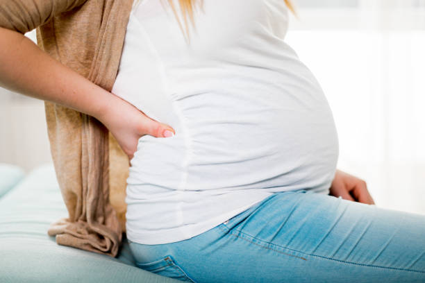 istock Lower back pain, discomfort during pregnancy 1209008783