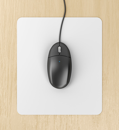 Black computer mouse on a mouse pad, top view