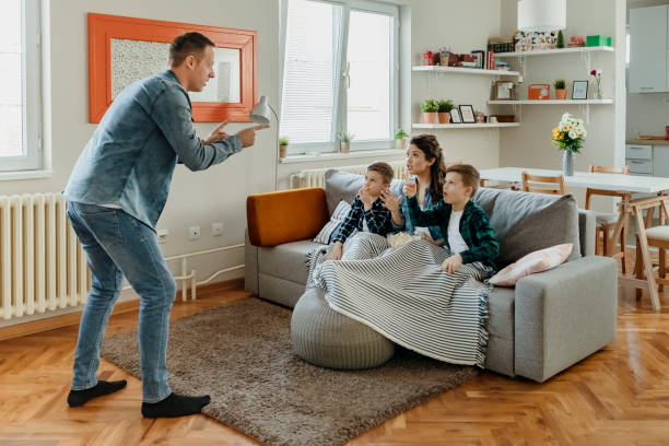 Family Playing Guessing Game Young Parents and Their Children Are Having Fun and Playing Charades Together. Portrait of Happy Family of Four Having Fun at Leisure. Entertainment Concept. pantomime stock pictures, royalty-free photos & images