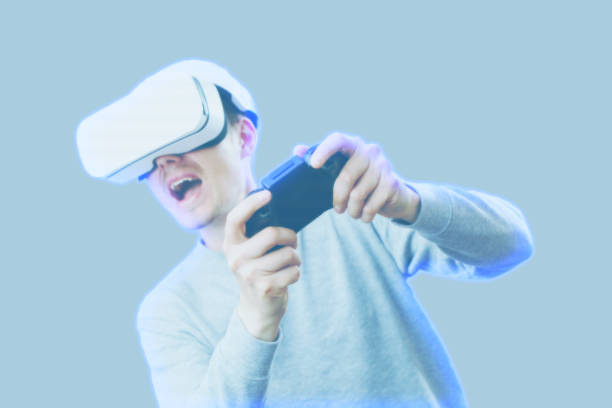 istock Man with virtual reality headset is playing game. Image with hologram effect. 1209011897