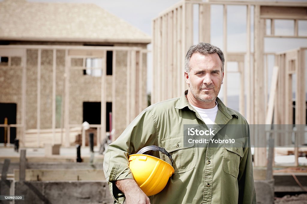 Rugged Male Construction Worker A rugged, tough male mature construction worker portrait Building Contractor Stock Photo