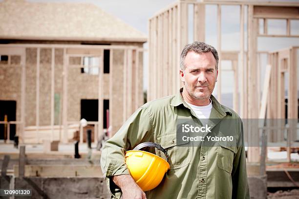 Rugged Male Construction Worker Stock Photo - Download Image Now - Building Contractor, Construction Worker, Portrait