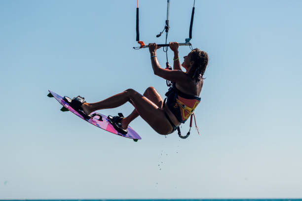 istock Fit young woman kite boarding 1209013751