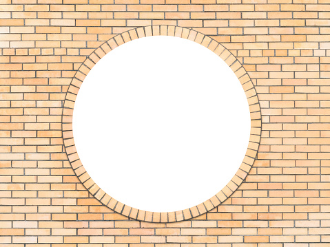 Brick wall with a round window in the middle