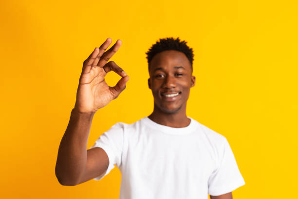 istock Positive african man gesturing showing ok sign 1209014609