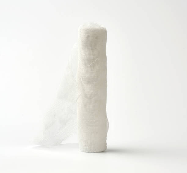 istock roll of white gauze bandage on a white background 1209016355