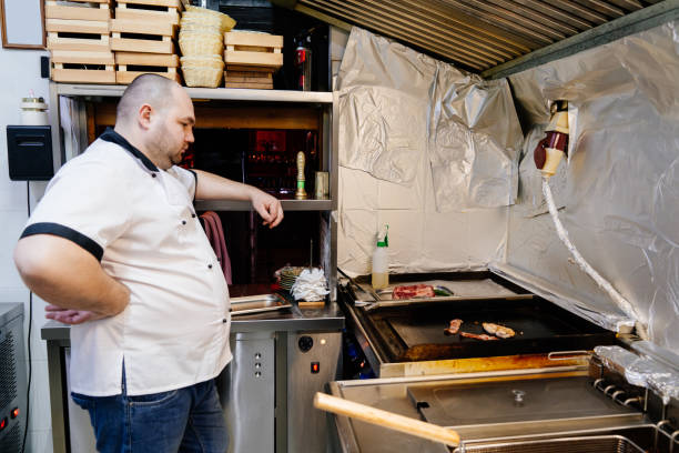 istock chef cooks piece of meat on plate and takes ready 1209016531