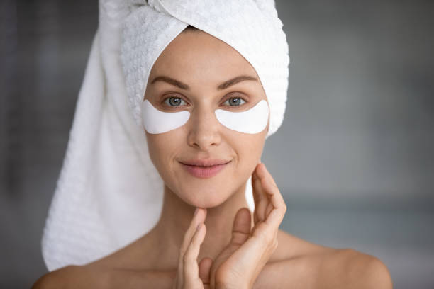 istock Head shot portrait beautiful woman with hydrogel eye patch 1209020097