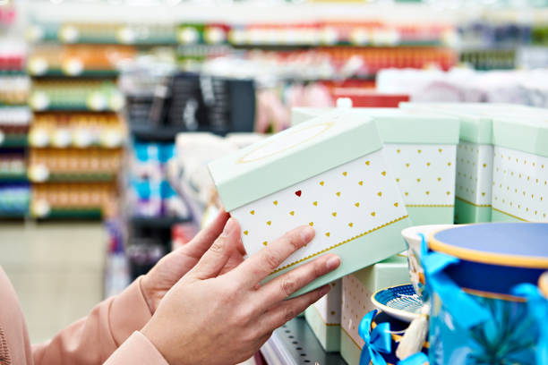 istock Gift box in hands of store 1209021502