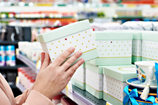 istock Gift box in hands of store 1209021629