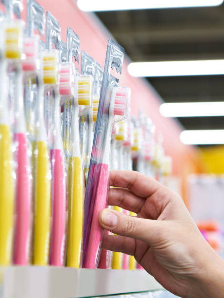 istock Toothbrush in package in hand in store 1209021871