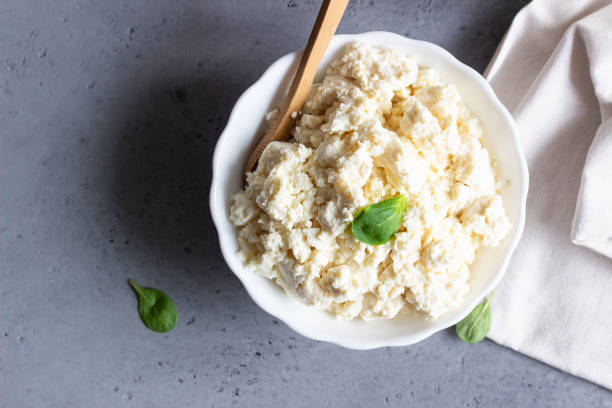 istock Organic ricotta cheese in white bowl. 1209022438