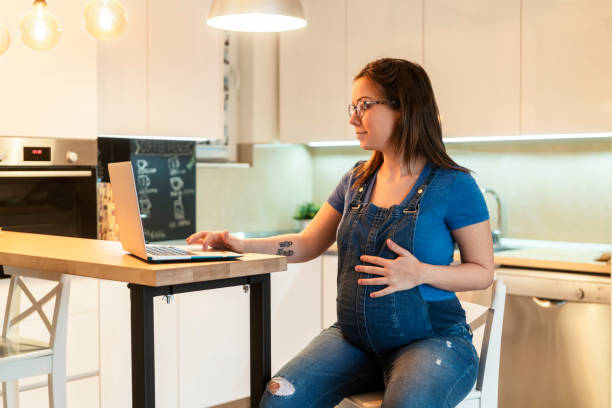 istock Pregnant woman at home 1209026311