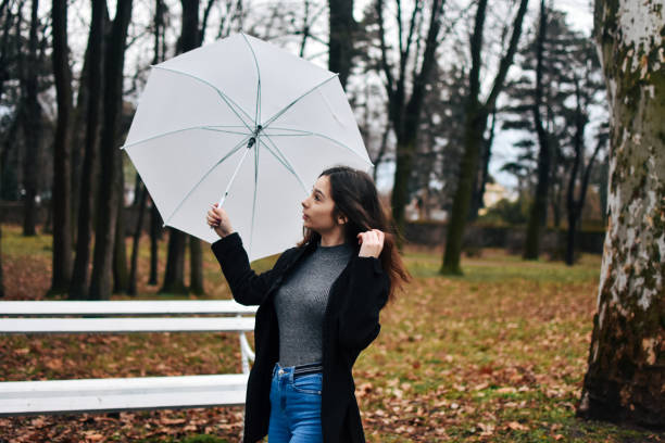 istock Beautiful young woman enjoying a rainy day 1209026475