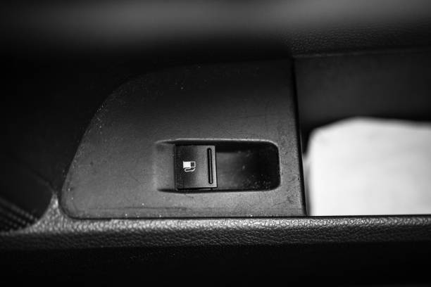 istock Close up photo inside a car, fuel pump button. 1209026768