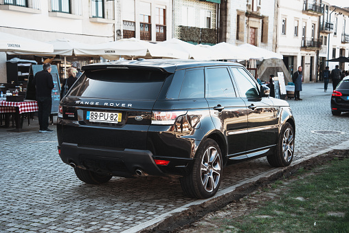 Porto, Portugal - 5 February 2020: A luxury Range Rover Sport 4x4 car in a street of Porto, Portugal