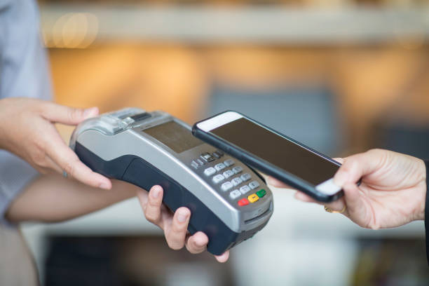 istock contactless payment by mobile phone in cafe 1209031782