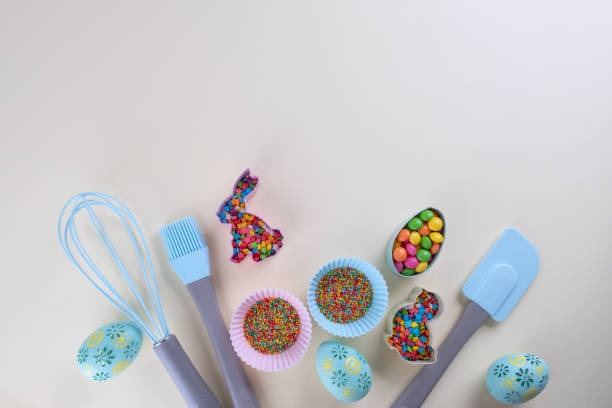 istock Preparation of gingerbread cookies. Easter cookies cutters, tools necessary to make gingerbread pastry, colored sprinkles. Easter concept. 1209031898