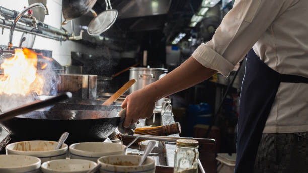 istock Chef stir fry cooking 1209033442
