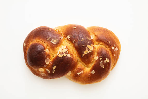 istock Easter greek tsoureki braid, sweet bread brioche isolated on white 1209035005