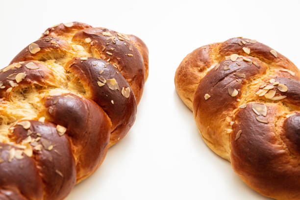 istock Easter greek tsoureki braid, sweet bread brioche isolated on white 1209035010