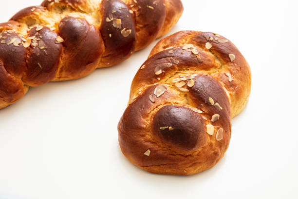 istock Easter greek tsoureki braid, sweet bread brioche isolated on white 1209035017