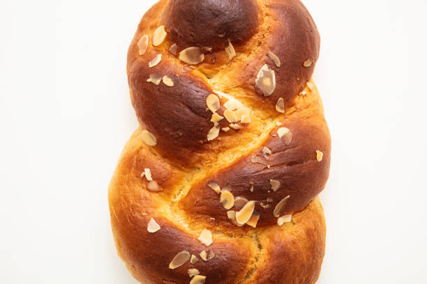 istock Easter greek tsoureki braid, sweet bread brioche isolated on white 1209035021
