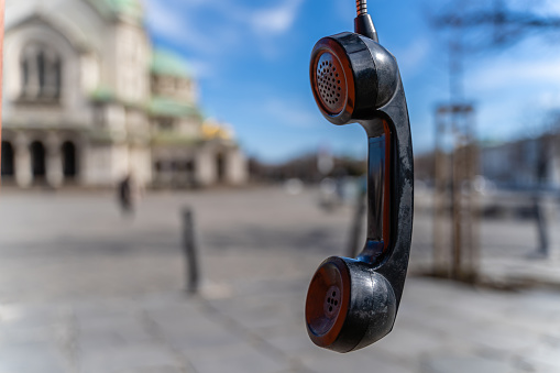 Handphone hanging in telephone booth in front of Alexander Nevski cathedral in Sofia, Bulgaria. The scene is situated in downtown district of Sofia, Bulgaria (Eastern Europe). The footage is taken with Sony A7III camera