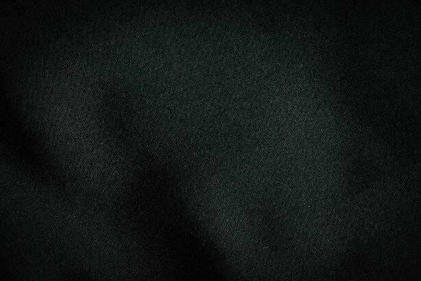 istock Black fabric, luxury dark gray background abstract. Material are used in textile assembly. Detail cloth texture of pattern. Design, elegance with vignette effect, free copy space for text placement. 1209036651