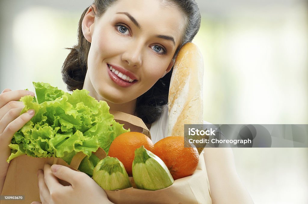 bag of food girl holding a bag of food Adult Stock Photo