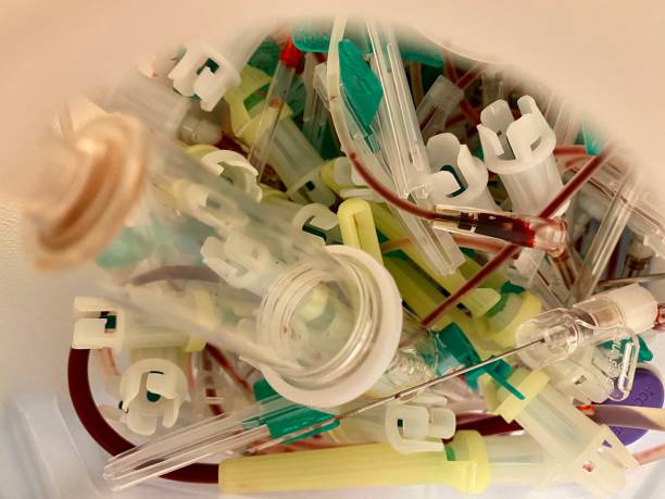 istock Medical waste and used syringes in container 1209041046