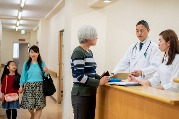 istock Senior patient checking into a hospital 1209041198