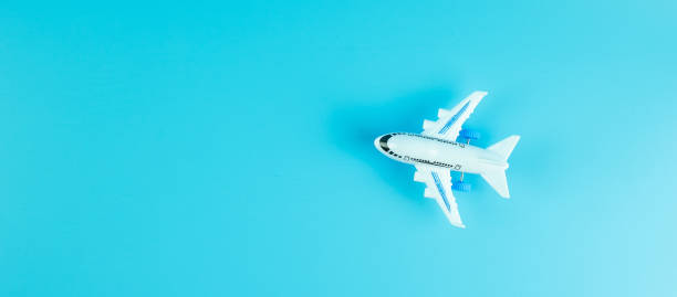 istock Top view airplane model on blue background with copy space for text 1209041651