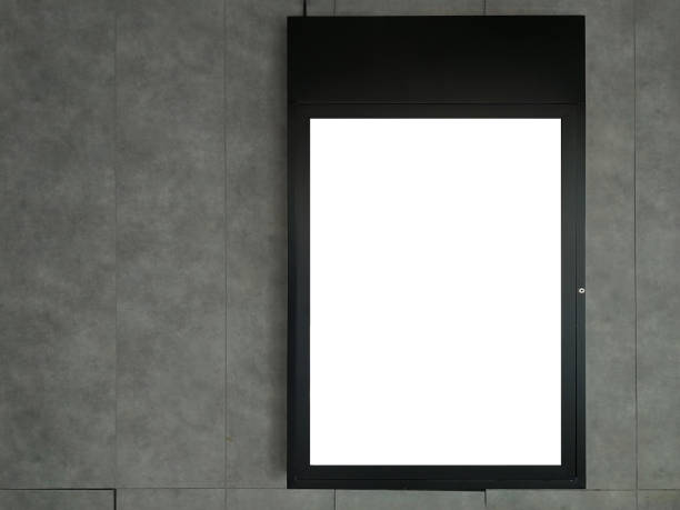 istock Black frame advertising signs with white background on bare cement or concrete wall 1209041781