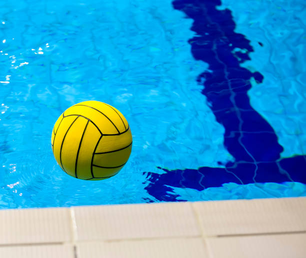 istock Yellow color water ball in swimming-pool 1209042879