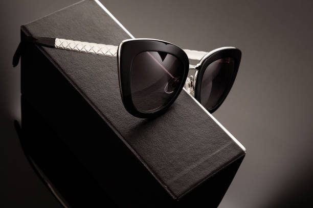 istock Fashionable sunglasses on a black box. 1209043051