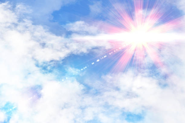 Cloudy blue sky with red and yellow sunbeam. Horizontal composition