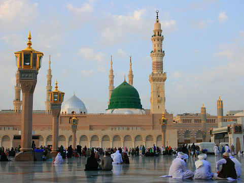 Muslims Rest in front of Prophet Mosque in Medina, Saudi Arabia