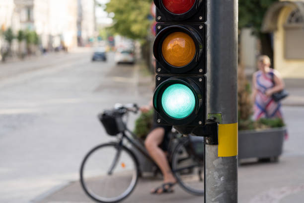 istock Girl on a bicycle at the traffic light 1209046274