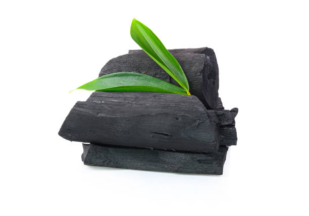 istock Natural wood charcoal on white background 1209046292