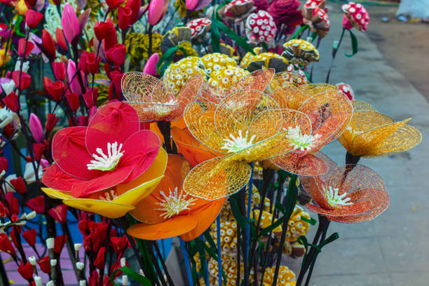 istock Decorative colorful artificial flowers are displayed for selling. 1209046352