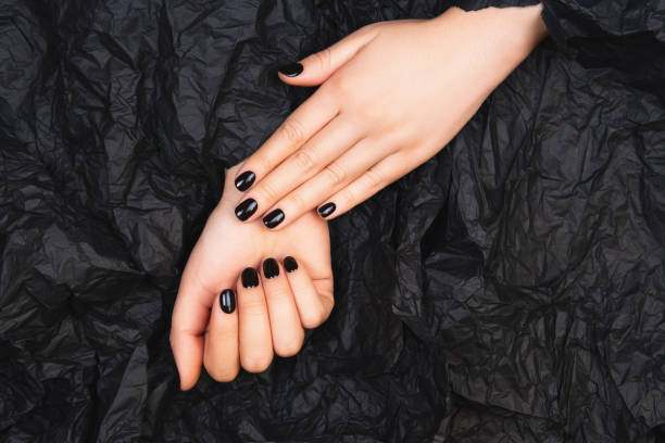 istock Black manicure with crumpled paper 1209047484