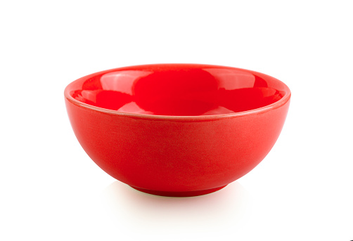 Empty red bowl on white background