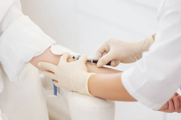 istock Doctor's hands take blood from a vein. Blood test concept 1209049557