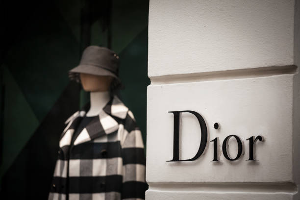 Logo of Christian Dior seen on their Prague main boutique Dior, or CD, is a French luxury goods company specialized in perfumes and fashion. stock photo