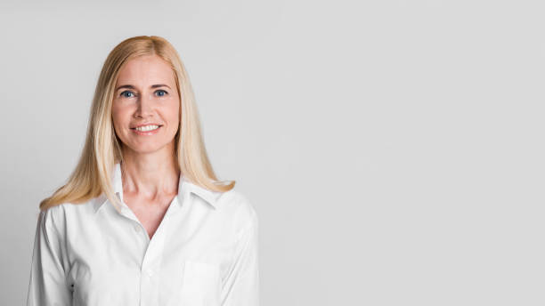istock Smiling middle-aged woman looking at camera at studio 1209051797