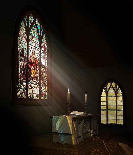 istock Stained glass window illuminates dark church 120905355