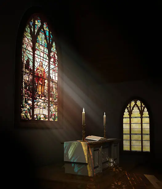 Photo of Stained glass window illuminates dark church