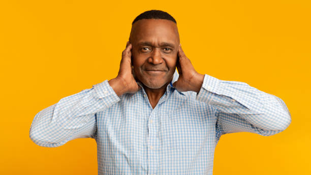 istock Middle aged african man closing his ears 1209053703