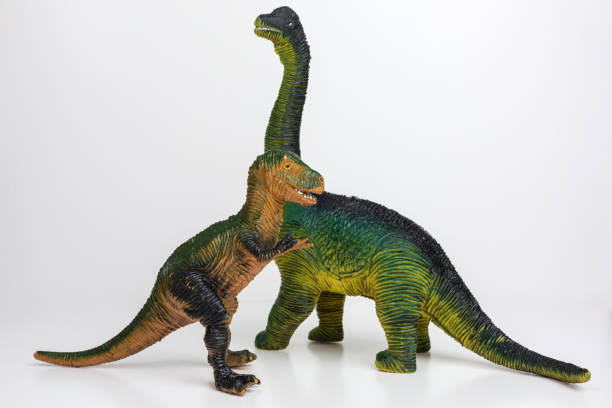 istock tyrannosaurus rex and brontosaur toy figures 1209054627